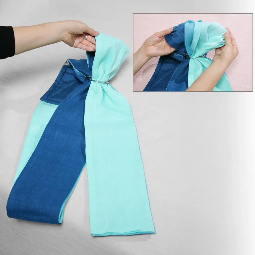 Fabric arranged in even accordion folds with each rail at one side of the rings