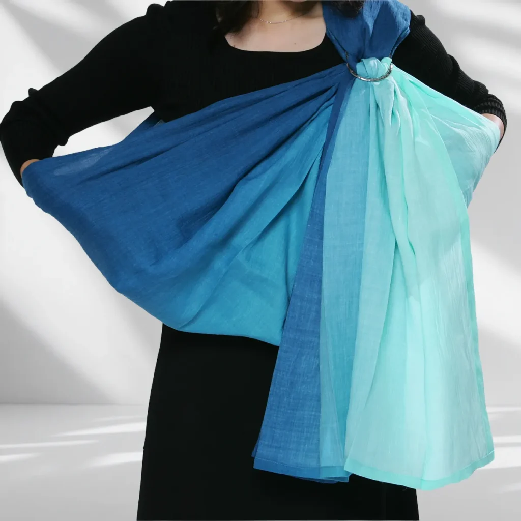Shape a rounded pouch in front of the chest with one hand inside the sling