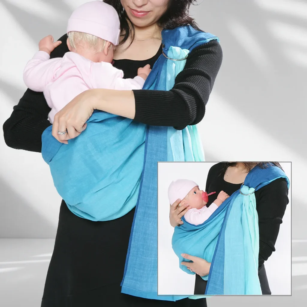 Baby seated deeply in the upright-carry pouch with legs around the wearer's torso