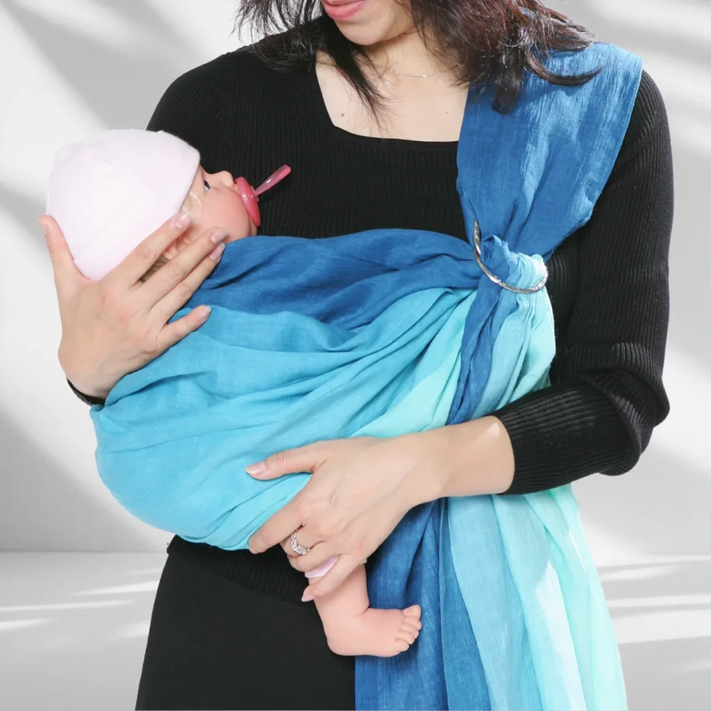 Completed upright carry with fabric supporting the back and bottom and both feet outside the pouch